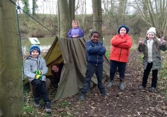 6 children from Cottingley Primary In front of there den